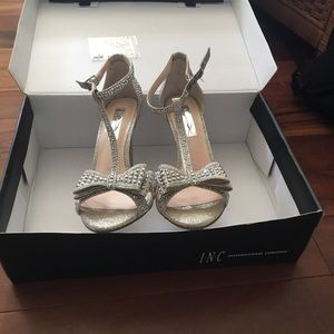 INC silver studded heels.